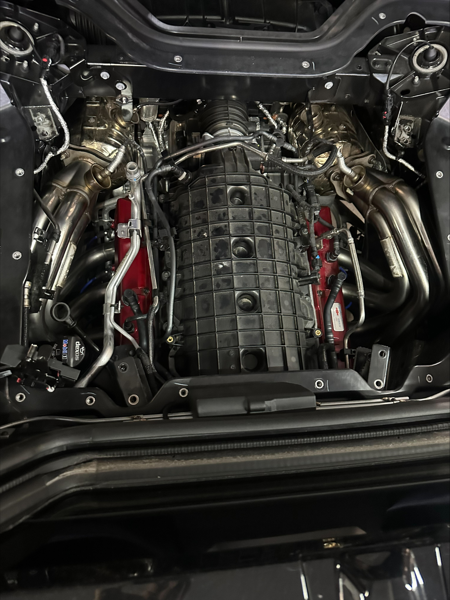 Custom long-tube headers installed on a C8 Corvette